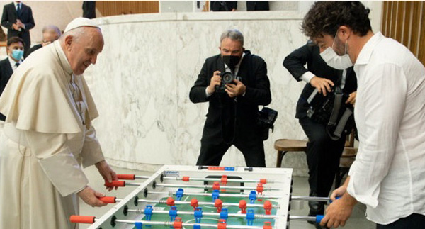 Francis playing foosball